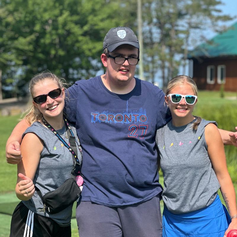 2026 - One Kids Place Summer Camp 4 Two Summer Camp Staff and boy posing for photo